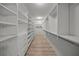 Large walk-in closet with ample shelving and hanging space at 4563 Trails Dr, Sarasota, FL 34232