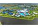 Community clubhouse, pools, and sports courts at 4852 Coastal Days Ln, Bradenton, FL 34211