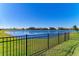 Private backyard oasis with lake view and fence at 4852 Coastal Days Ln, Bradenton, FL 34211