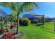 Landscaped backyard with lush tropical plants at 4852 Coastal Days Ln, Bradenton, FL 34211