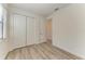 Bright bedroom with large closet and wood-look floors at 4852 Coastal Days Ln, Bradenton, FL 34211