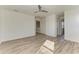 Bright bedroom with wood-look floors and access to bath at 4852 Coastal Days Ln, Bradenton, FL 34211