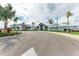 Community clubhouse with palm trees and ample parking at 4852 Coastal Days Ln, Bradenton, FL 34211