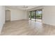 Gathering room with light tile flooring and sliding glass doors at 4852 Coastal Days Ln, Bradenton, FL 34211