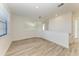 Bright loft area with wood-look floors and large window at 4852 Coastal Days Ln, Bradenton, FL 34211