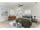 Main bedroom with wood floors and stylish decor at 4852 Coastal Days Ln, Bradenton, FL 34211