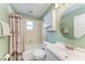 Clean bathroom with a tub, shower, and updated vanity at 5613 Garden Lakes Dr, Bradenton, FL 34203