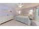 Spacious bedroom with light walls and a king-size bed at 5613 Garden Lakes Dr, Bradenton, FL 34203