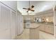 Bright kitchen with granite countertops, white appliances, and an island at 5613 Garden Lakes Dr, Bradenton, FL 34203