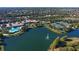 Aerial view of community with lake and tennis courts at 5781 Girona Pl, Sarasota, FL 34238