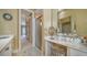 Bathroom with walk-in shower and double vanity at 5781 Girona Pl, Sarasota, FL 34238