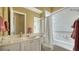 Clean bathroom with shower/tub combo and updated vanity at 5781 Girona Pl, Sarasota, FL 34238