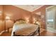 Relaxing bedroom with a queen bed and mirrored closet at 5781 Girona Pl, Sarasota, FL 34238