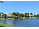 Resort-style community pool with palm trees and gazebo at 5781 Girona Pl, Sarasota, FL 34238