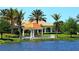 Gazebo with lake view in a lush, tropical community at 5781 Girona Pl, Sarasota, FL 34238