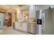 Modern kitchen with stainless steel appliances and granite countertops at 5781 Girona Pl, Sarasota, FL 34238