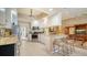 Updated kitchen with stainless steel appliances and granite countertops at 5781 Girona Pl, Sarasota, FL 34238