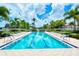 Community lap pool with lounge chairs at 5781 Girona Pl, Sarasota, FL 34238