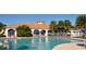 Community pool with lounge chairs and umbrellas at 5781 Girona Pl, Sarasota, FL 34238