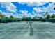 Community tennis courts offer ample space for friendly competition at 5781 Girona Pl, Sarasota, FL 34238