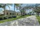 Community walkway alongside lake and homes at 5781 Girona Pl, Sarasota, FL 34238