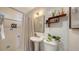 Clean bathroom with pedestal sink and updated fixtures at 603 Barnes Pkwy, Nokomis, FL 34275