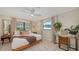 Spacious primary bedroom featuring a king-size bed and a built-in workspace at 603 Barnes Pkwy, Nokomis, FL 34275