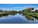 Tranquil canal view with neighboring houses at 603 Barnes Pkwy, Nokomis, FL 34275