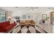 Living room with terrazzo floor, mid-century modern decor, and open floor plan at 603 Barnes Pkwy, Nokomis, FL 34275