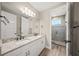 Double vanity bathroom with granite countertops at 6229 Rivo Lakes Blvd, Sarasota, FL 34241