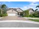 Two-story home with tile roof and landscaping at 6229 Rivo Lakes Blvd, Sarasota, FL 34241