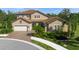 Two-story home with tile roof and landscaping at 6229 Rivo Lakes Blvd, Sarasota, FL 34241