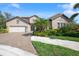 Two-story home with tile roof and landscaping at 6229 Rivo Lakes Blvd, Sarasota, FL 34241