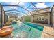 Relaxing pool and spa with outdoor kitchen at 6229 Rivo Lakes Blvd, Sarasota, FL 34241