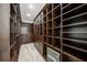 Large walk-in closet with ample shelving and built-in safe at 6229 Rivo Lakes Blvd, Sarasota, FL 34241