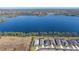 Wide aerial view of single-Gathering homes near a serene lake at 6347 Grandview Hill Ct, Bradenton, FL 34203