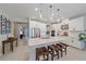 Modern kitchen with white cabinets, quartz countertops, and stainless steel appliances at 6347 Grandview Hill Ct, Bradenton, FL 34203