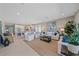 Bright living room with open floor plan, featuring comfortable seating and large windows at 6347 Grandview Hill Ct, Bradenton, FL 34203