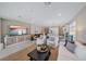 Bright living room featuring tile floors, neutral decor, and an open-concept layout at 6347 Grandview Hill Ct, Bradenton, FL 34203