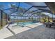 Relaxing pool and spa area with screened enclosure and lake view at 6347 Grandview Hill Ct, Bradenton, FL 34203