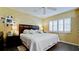 Main bedroom with king-size bed and ample natural light at 6405 Auburn Ave # 8, Bradenton, FL 34207