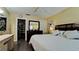 Bedroom with a queen bed, large closet, and dresser at 6405 Auburn Ave # 8, Bradenton, FL 34207