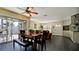 Bright dining room features a wooden table and access to a patio at 6405 Auburn Ave # 8, Bradenton, FL 34207