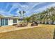 Outdoor patio with seating area, adjacent to a lush lawn and pool at 6429 Hollywood Blvd, Sarasota, FL 34231