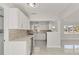 Updated kitchen with white cabinets and quartz countertops at 6429 Hollywood Blvd, Sarasota, FL 34231