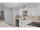 Modern white kitchen with quartz countertops and stainless steel appliances at 6429 Hollywood Blvd, Sarasota, FL 34231