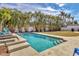 Relaxing pool area with steps and a spacious backyard at 6429 Hollywood Blvd, Sarasota, FL 34231