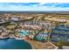 Aerial view of community with pool, tennis courts, and clubhouse at 6730 Haverhill Ct, Bradenton, FL 34202