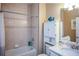 Small bathroom with a bathtub, toilet and linen cabinet at 6730 Haverhill Ct, Bradenton, FL 34202