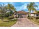 Single-story home with a two-car garage and landscaped yard at 6730 Haverhill Ct, Bradenton, FL 34202